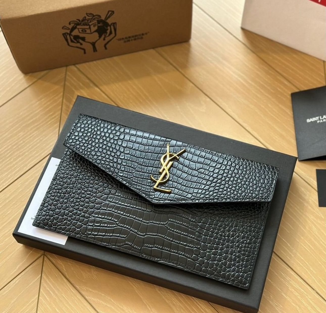 YSL uptown pouch in crocodile-embossed shiny leather
