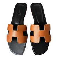 Hermès Oran Leather Sandal in Brown with Black Sole