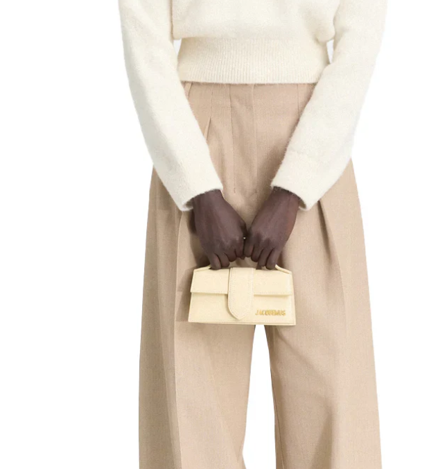 The Bambino Small handbag with adjustable crossbody strap.