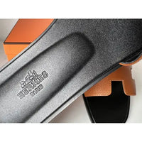 Hermès Oran Leather Sandal in Brown with Black Sole