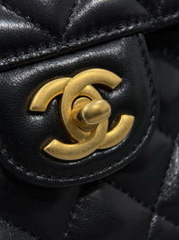 Chanel – Top Handle Flap Bag (Black Lambskin Leather)