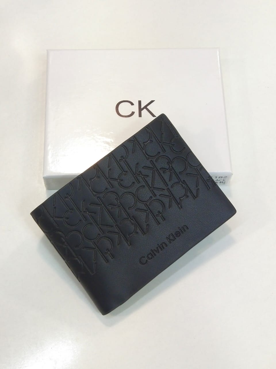 Calvin Klein – Embossed Logo Bi-Fold Wallet